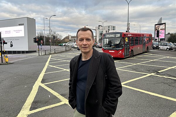 Christophe by crossing outside Shepherd's Bush Station